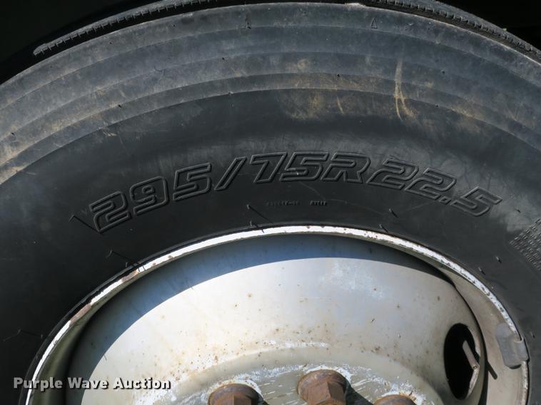 image for item DB8975 2000 International 4700 flat dump bed truck