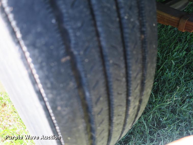 image for item DB8975 2000 International 4700 flat dump bed truck