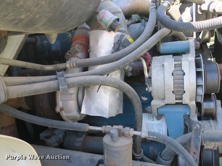 image for item DB8975 2000 International 4700 flat dump bed truck