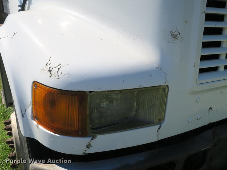 image for item DB8975 2000 International 4700 flat dump bed truck