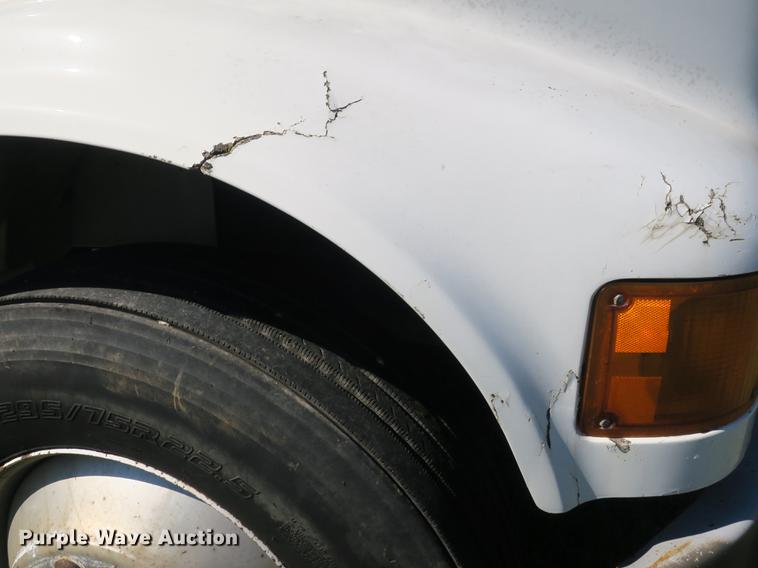 image for item DB8975 2000 International 4700 flat dump bed truck