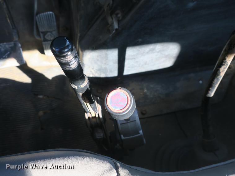 image for item DB8975 2000 International 4700 flat dump bed truck