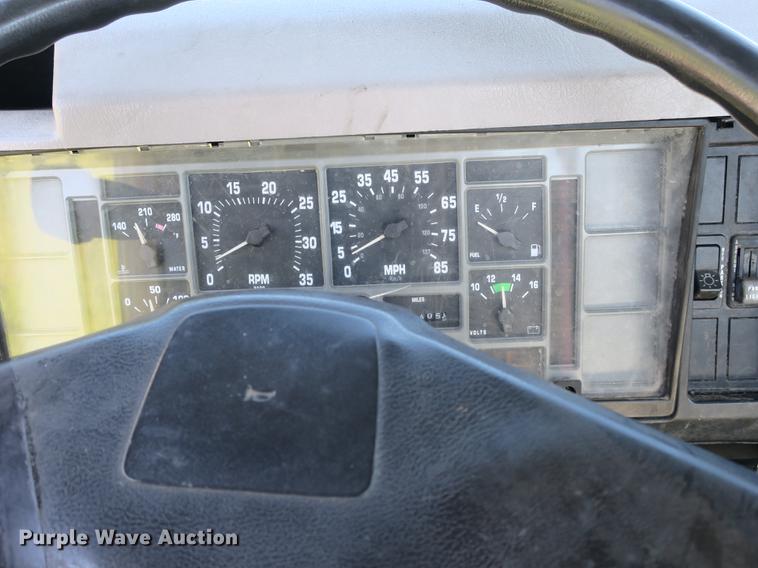 image for item DB8975 2000 International 4700 flat dump bed truck