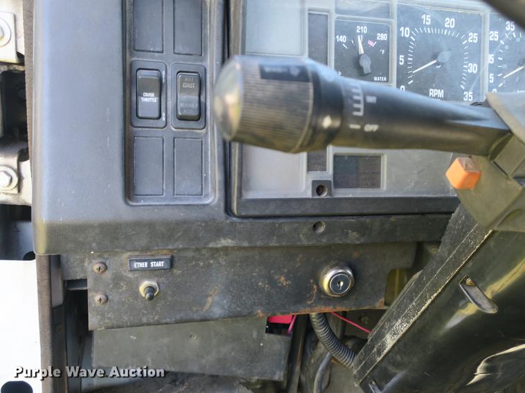 image for item DB8975 2000 International 4700 flat dump bed truck