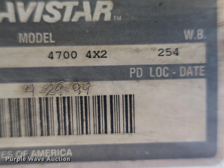 image for item DB8975 2000 International 4700 flat dump bed truck