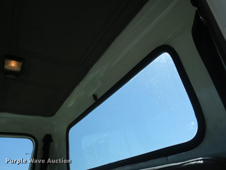 image for item DB8975 2000 International 4700 flat dump bed truck