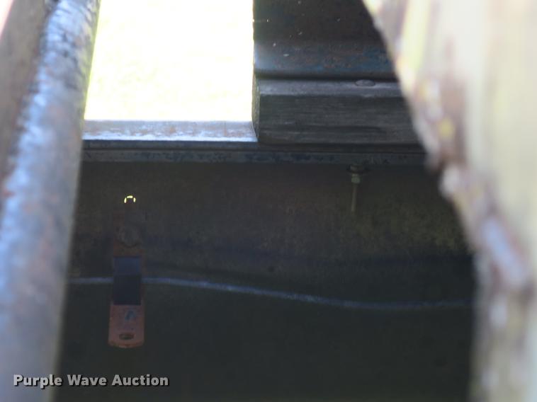 image for item DB8975 2000 International 4700 flat dump bed truck