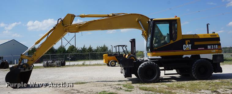 image for item DD6552 1995 Caterpillar M318 rubber tire excavator
