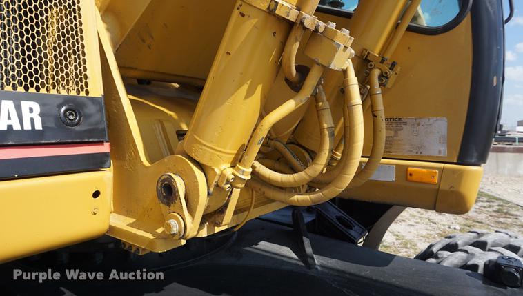 image for item DD6552 1995 Caterpillar M318 rubber tire excavator