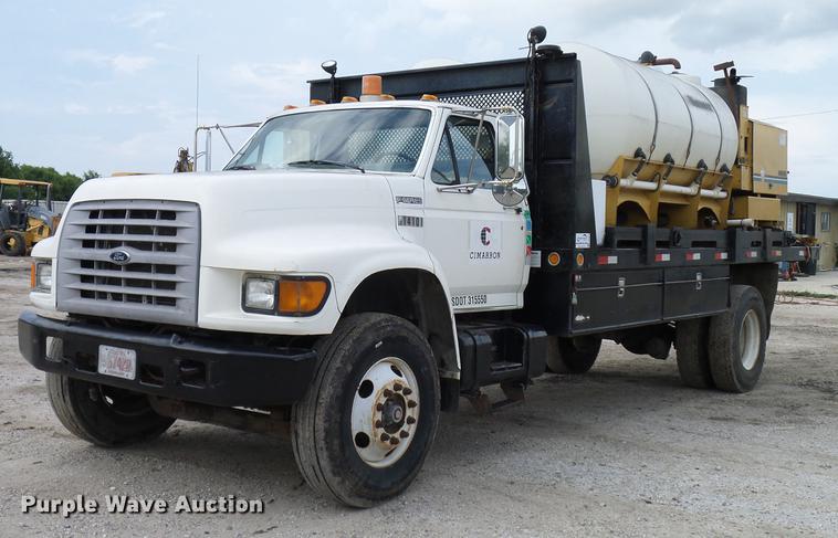 image for item DD8312 1998 Ford F800 flatbed truck with Vermeer MTE37 mud mix system