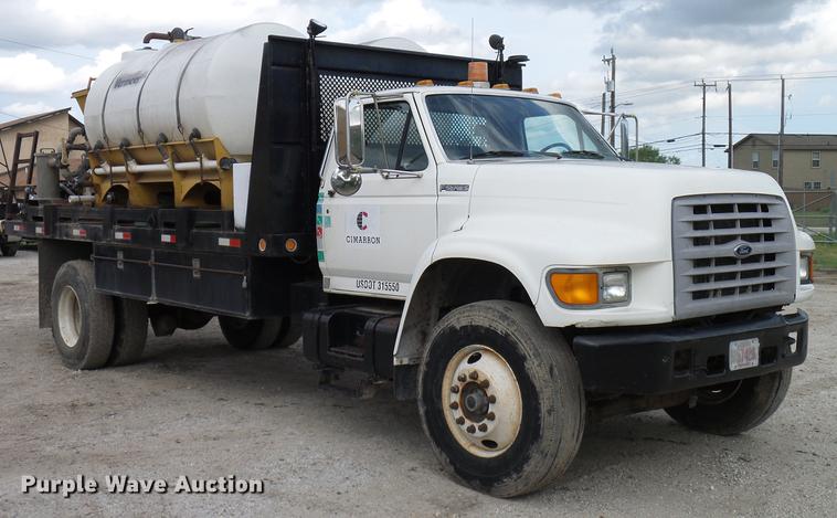 image for item DD8312 1998 Ford F800 flatbed truck with Vermeer MTE37 mud mix system