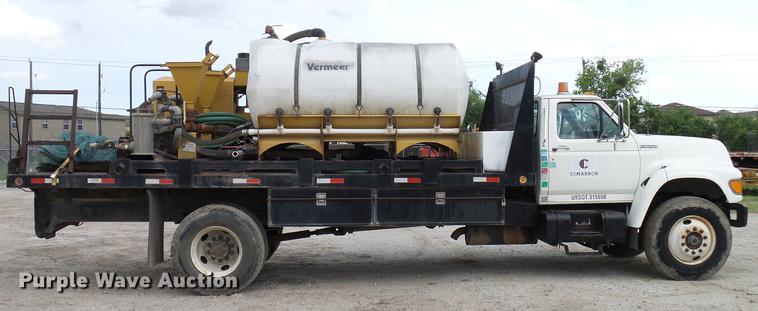 image for item DD8312 1998 Ford F800 flatbed truck with Vermeer MTE37 mud mix system