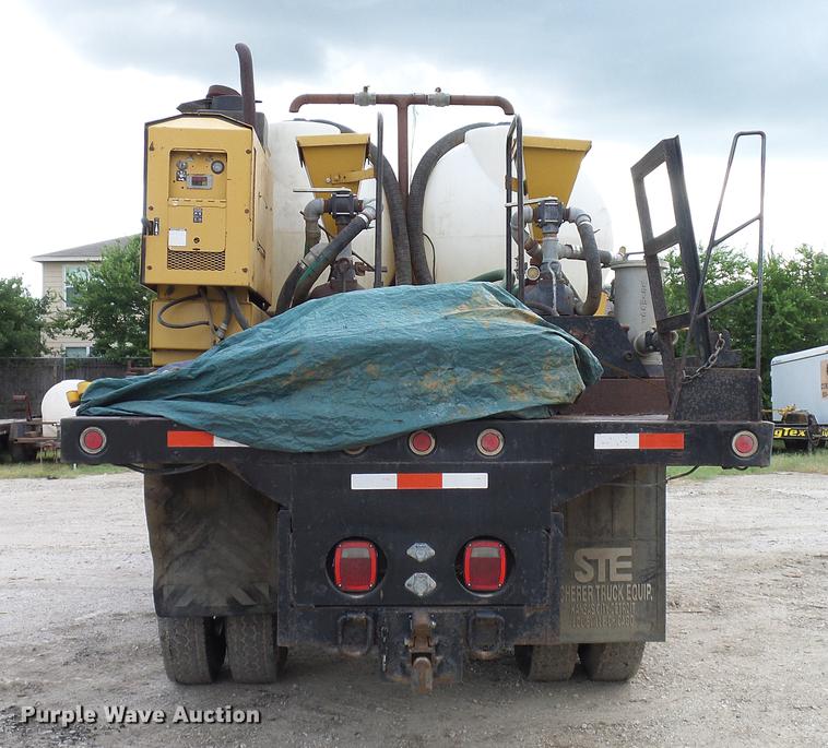 image for item DD8312 1998 Ford F800 flatbed truck with Vermeer MTE37 mud mix system