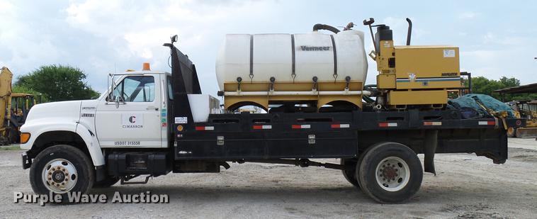 image for item DD8312 1998 Ford F800 flatbed truck with Vermeer MTE37 mud mix system