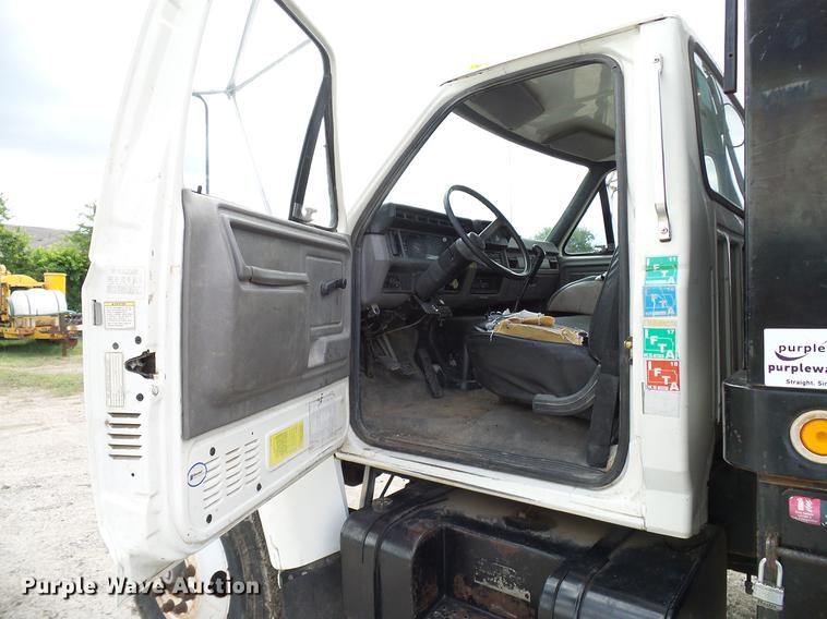 image for item DD8312 1998 Ford F800 flatbed truck with Vermeer MTE37 mud mix system