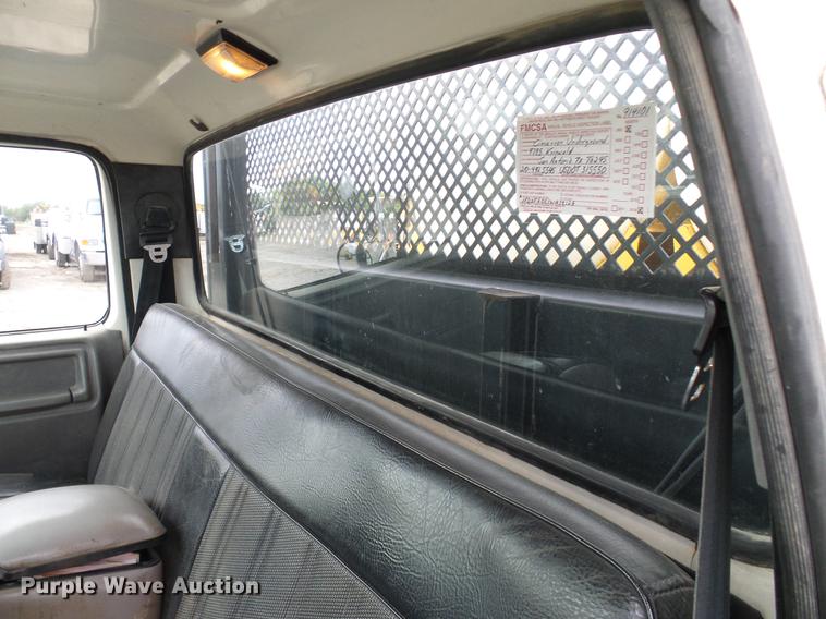 image for item DD8312 1998 Ford F800 flatbed truck with Vermeer MTE37 mud mix system