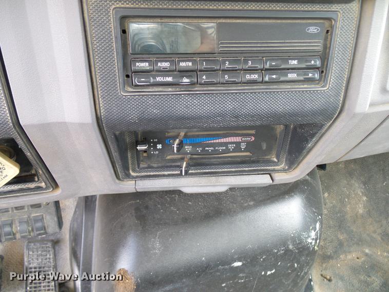 image for item DD8312 1998 Ford F800 flatbed truck with Vermeer MTE37 mud mix system