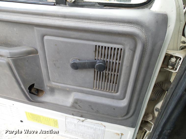 image for item DD8312 1998 Ford F800 flatbed truck with Vermeer MTE37 mud mix system