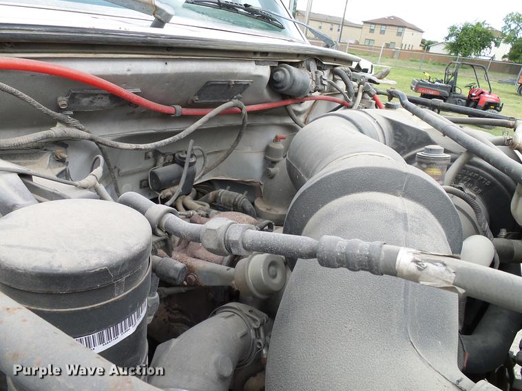 image for item DD8312 1998 Ford F800 flatbed truck with Vermeer MTE37 mud mix system