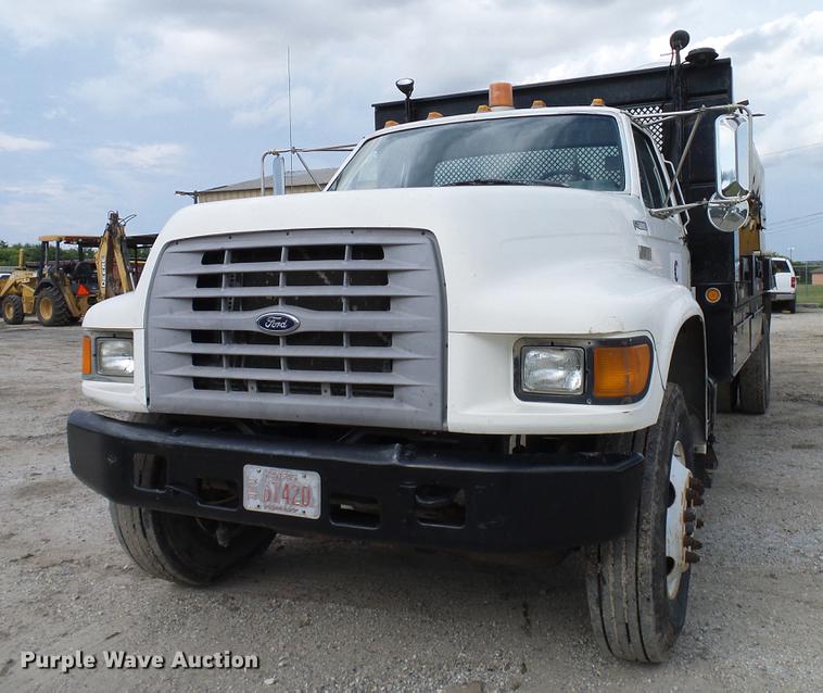 image for item DD8312 1998 Ford F800 flatbed truck with Vermeer MTE37 mud mix system