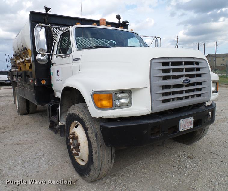image for item DD8312 1998 Ford F800 flatbed truck with Vermeer MTE37 mud mix system