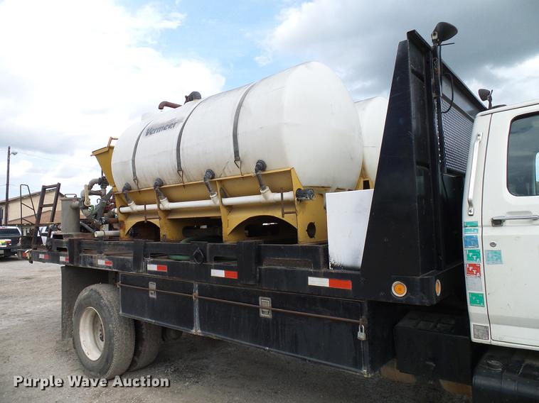 image for item DD8312 1998 Ford F800 flatbed truck with Vermeer MTE37 mud mix system