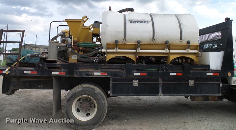 image for item DD8312 1998 Ford F800 flatbed truck with Vermeer MTE37 mud mix system