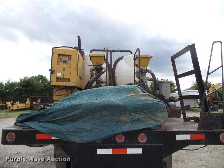 image for item DD8312 1998 Ford F800 flatbed truck with Vermeer MTE37 mud mix system