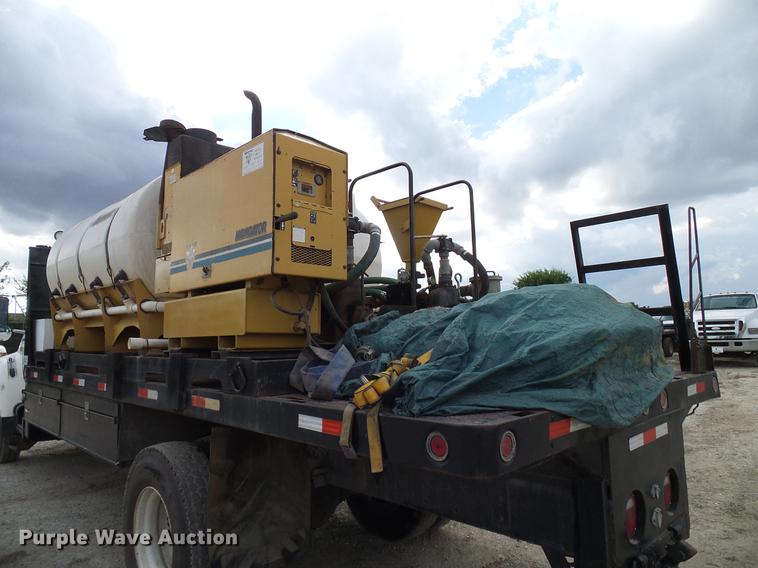 image for item DD8312 1998 Ford F800 flatbed truck with Vermeer MTE37 mud mix system