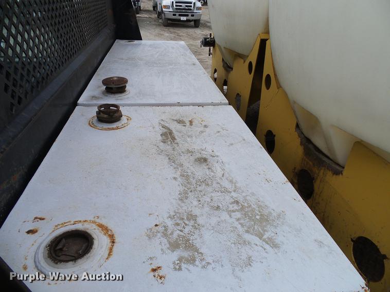 image for item DD8312 1998 Ford F800 flatbed truck with Vermeer MTE37 mud mix system