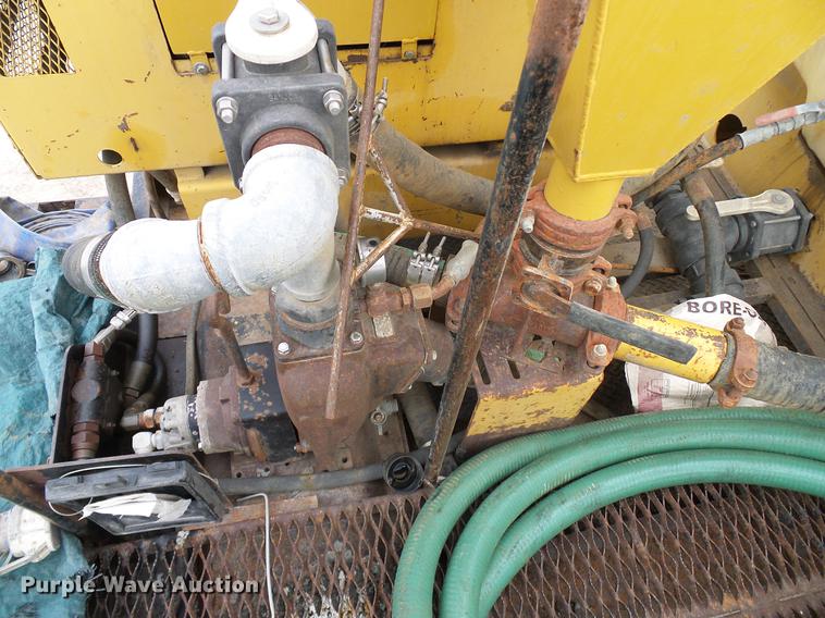 image for item DD8312 1998 Ford F800 flatbed truck with Vermeer MTE37 mud mix system