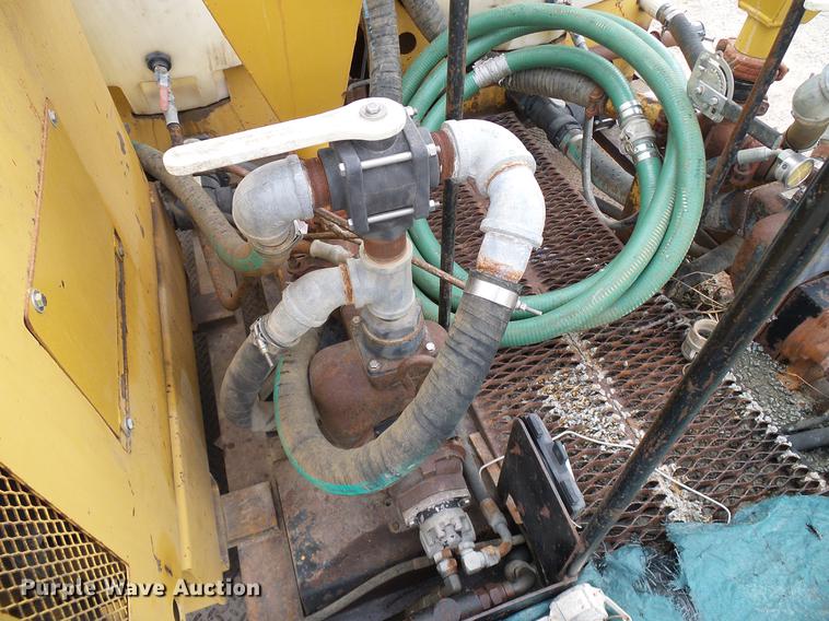 image for item DD8312 1998 Ford F800 flatbed truck with Vermeer MTE37 mud mix system