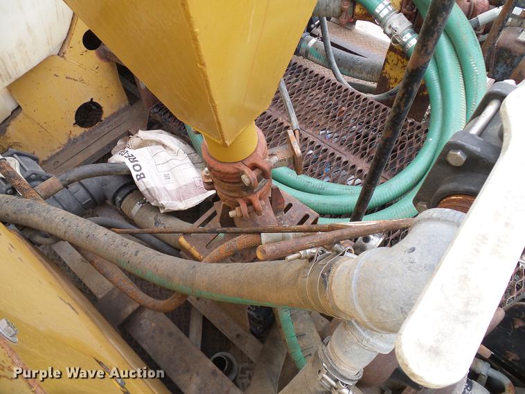 image for item DD8312 1998 Ford F800 flatbed truck with Vermeer MTE37 mud mix system