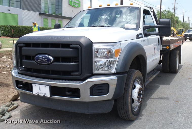image for item DD8330 2014 Ford F550 Super Duty flat bed truck