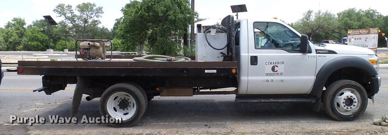 image for item DD8330 2014 Ford F550 Super Duty flat bed truck