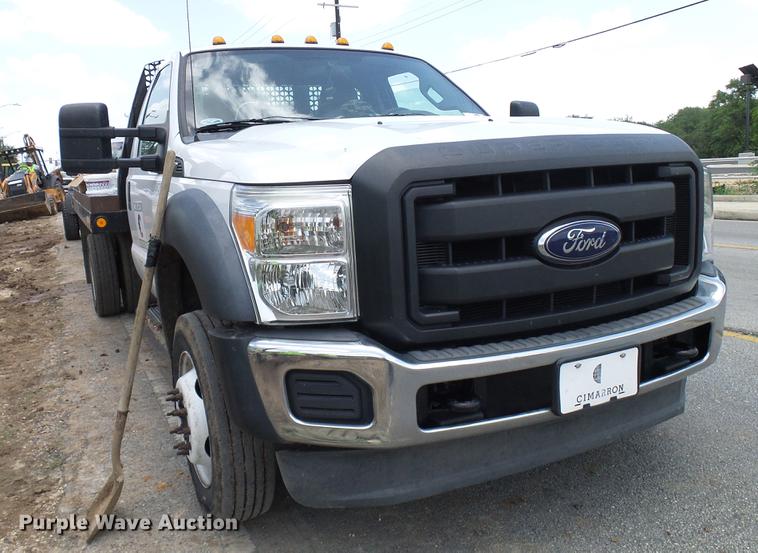 image for item DD8330 2014 Ford F550 Super Duty flat bed truck