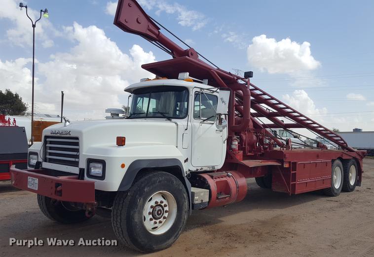 image for item EI9663 2004 Mack RD690SX flatbed winch truck