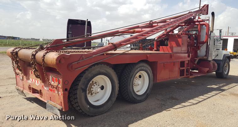 image for item EI9663 2004 Mack RD690SX flatbed winch truck