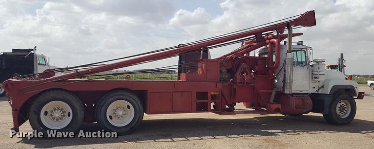 image for item EI9663 2004 Mack RD690SX flatbed winch truck