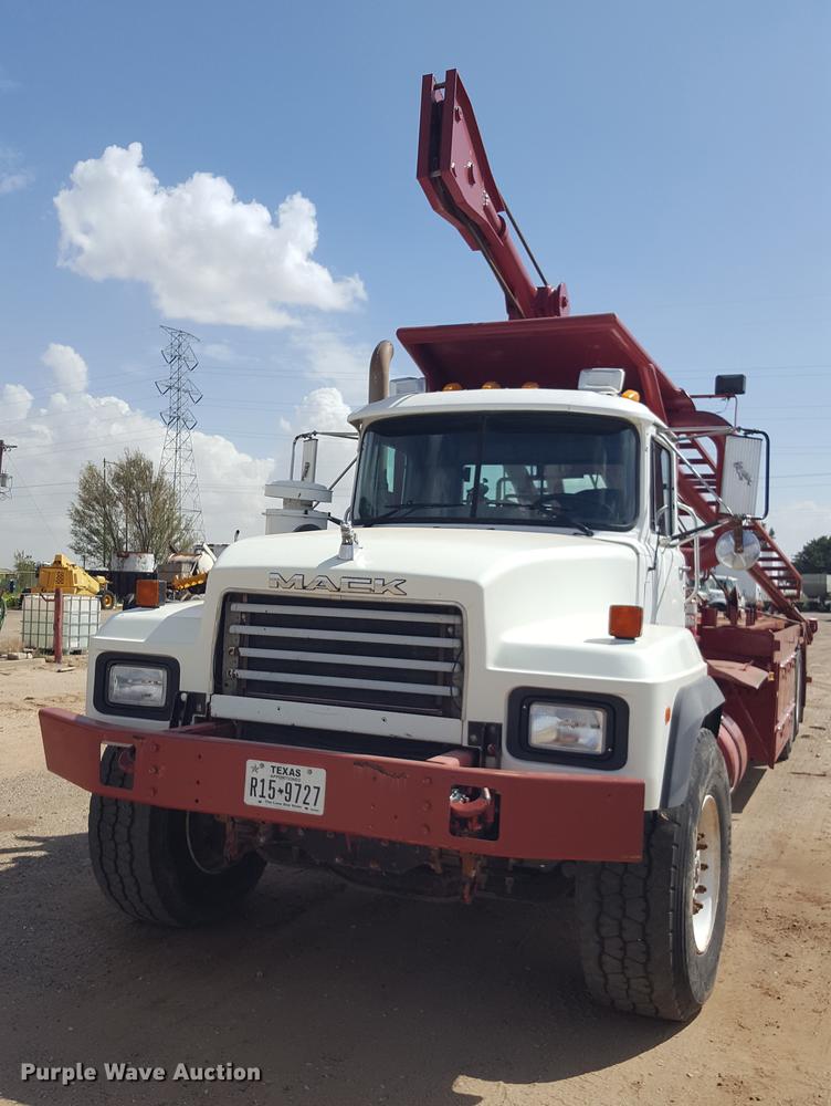 image for item EI9663 2004 Mack RD690SX flatbed winch truck