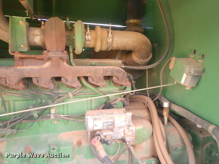 image for item DE6472 2009 John Deere 4995 windrower