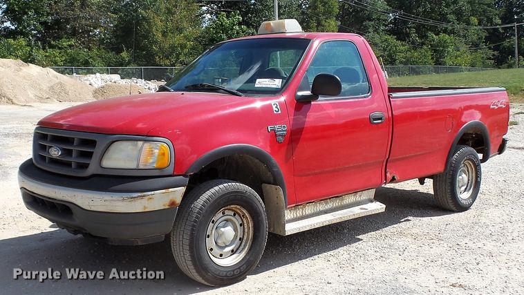 image for item DD7412 2000 Ford F150 flatbed pickup truck
