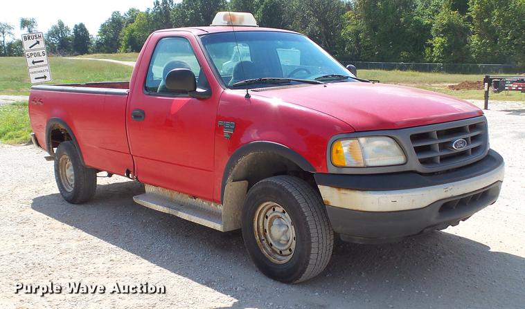 image for item DD7412 2000 Ford F150 flatbed pickup truck