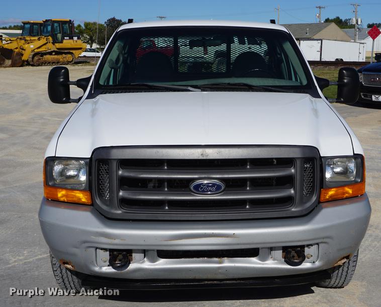 image for item DD6635 2001 Ford F250 Super Duty SuperCab flatbed pickup truck