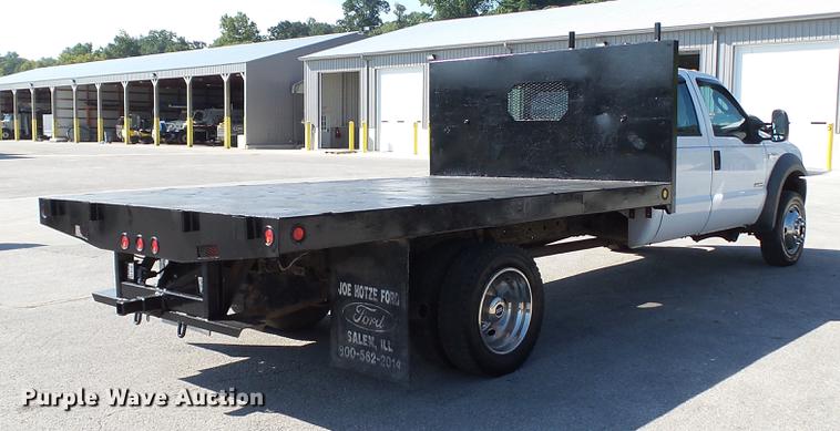 image for item DD7399 2005 Ford F550 Super Duty XL Crew Cab flatbed truck