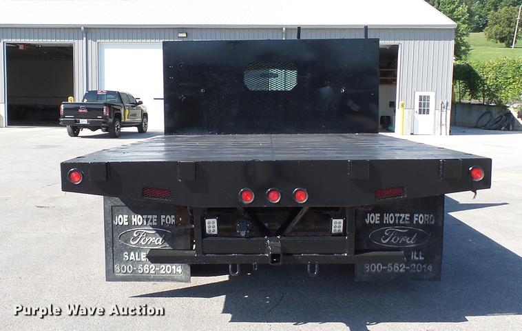 image for item DD7399 2005 Ford F550 Super Duty XL Crew Cab flatbed truck
