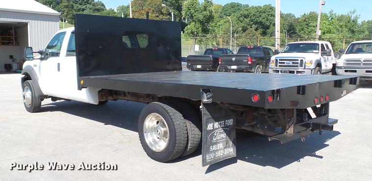 image for item DD7399 2005 Ford F550 Super Duty XL Crew Cab flatbed truck