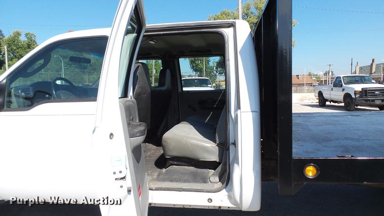 image for item DD7399 2005 Ford F550 Super Duty XL Crew Cab flatbed truck