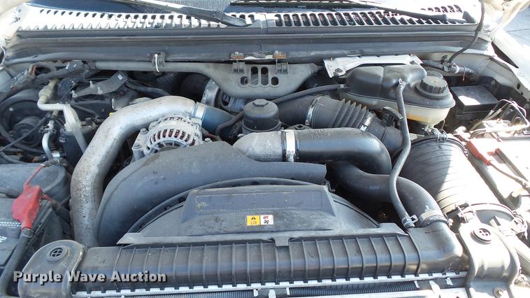 image for item DD7399 2005 Ford F550 Super Duty XL Crew Cab flatbed truck