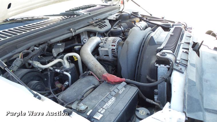 image for item DD7399 2005 Ford F550 Super Duty XL Crew Cab flatbed truck